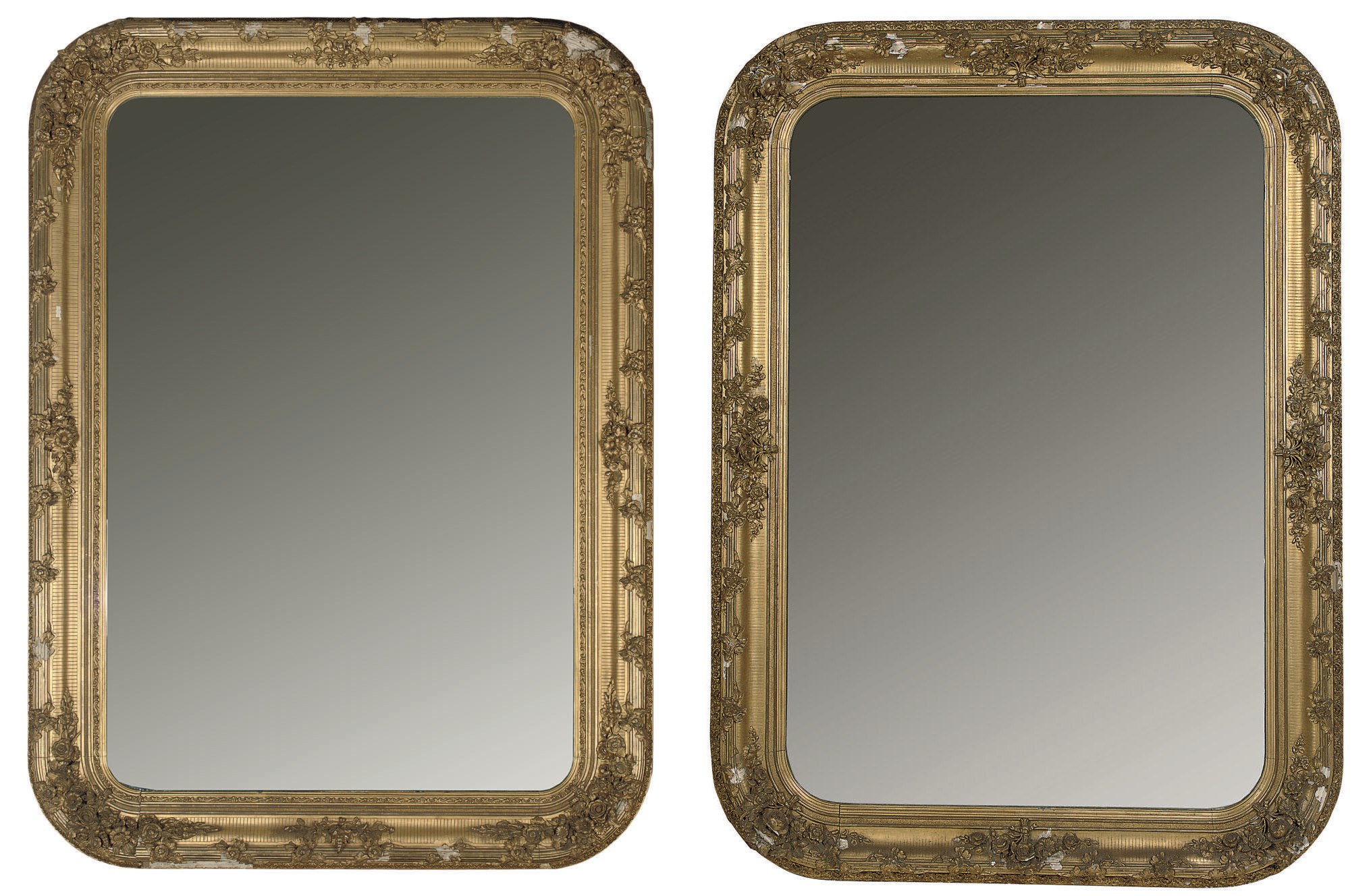 A NEAR PAIR OF OVERSIZED NAPOLEON III GILTWOOD AND GESSO MIRRORS