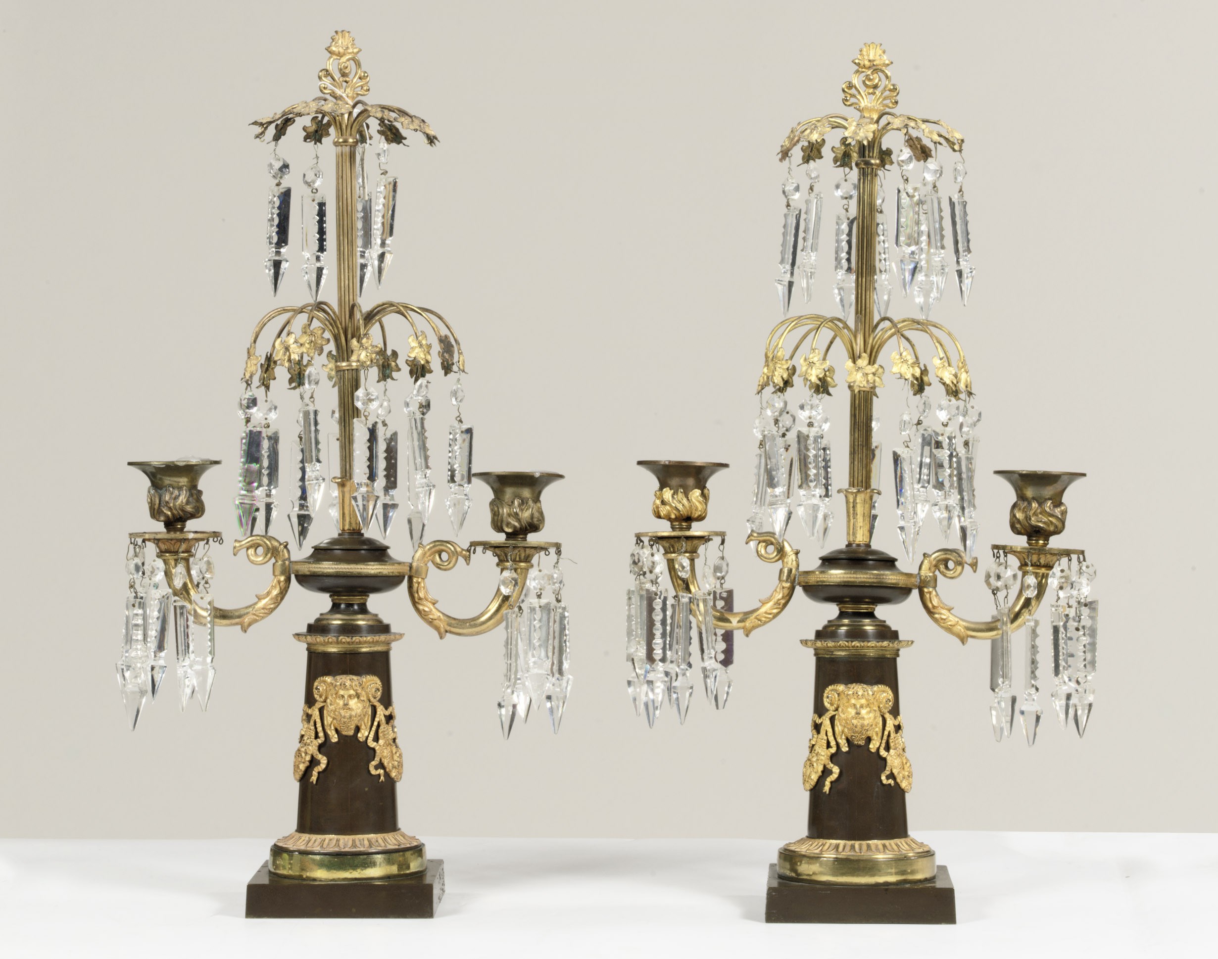 A PAIR OF ORMOLU, PATINATED BRONZE AND CUT GLASS CANDELABRA