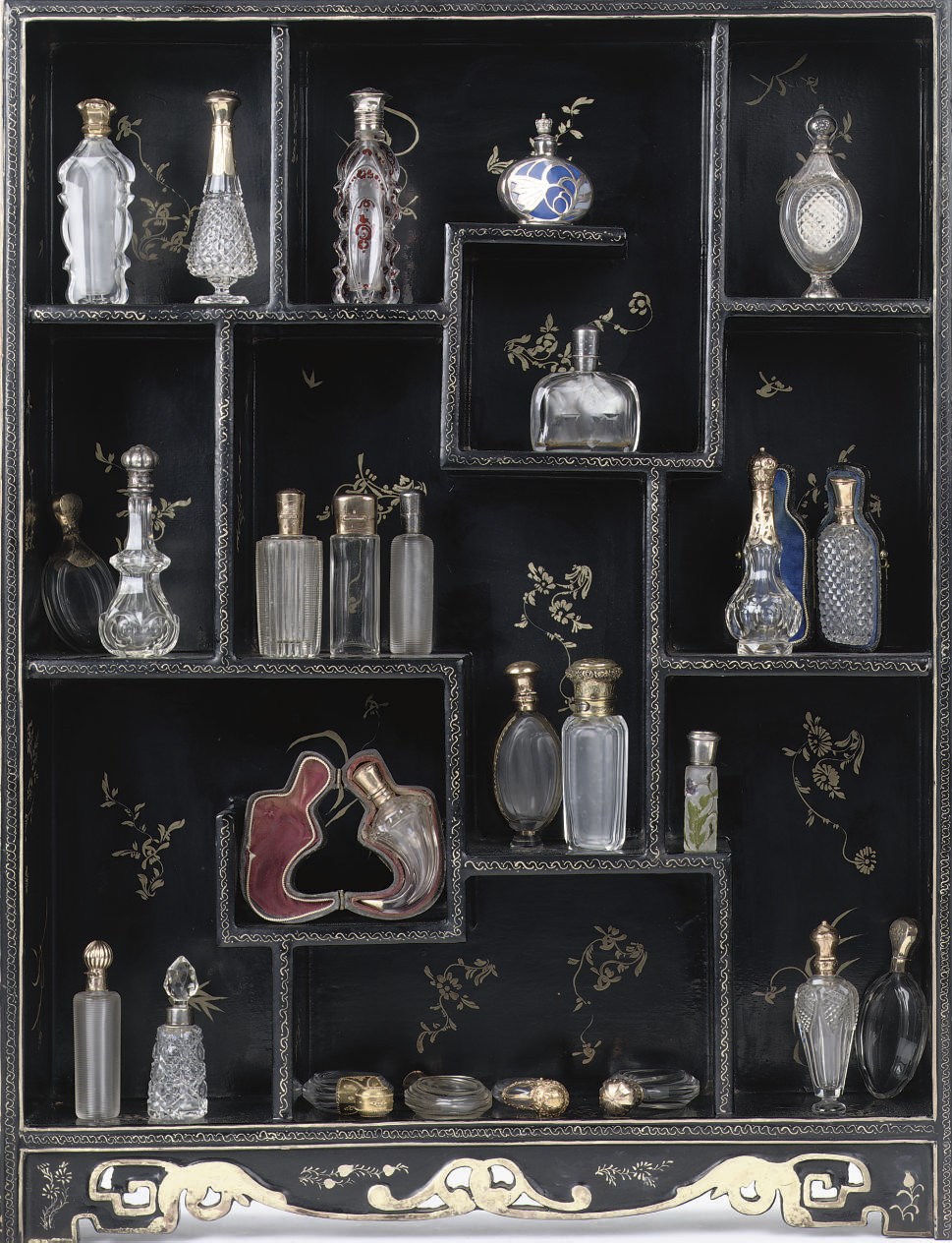 A COLLECTION OF TWENTY-SIX VARIOUS PERFUME BOTTLES WITH GOLD, SILVER, BRASS OR ENAMEL MOUNTS AND DECORATION