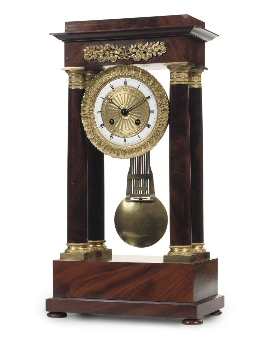 A LOUIS PHILIPPE ORMOLU-MOUNTED MAHOGANY STRIKING PORTICO CLOCK