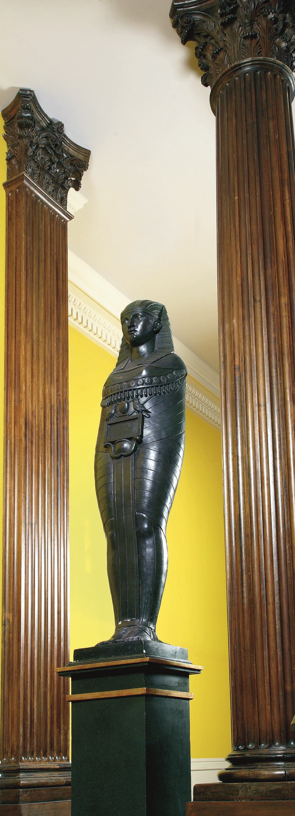 A BRONZED PLASTER CARYATID FIGURE OF AN EGYPTIAN GODDESS