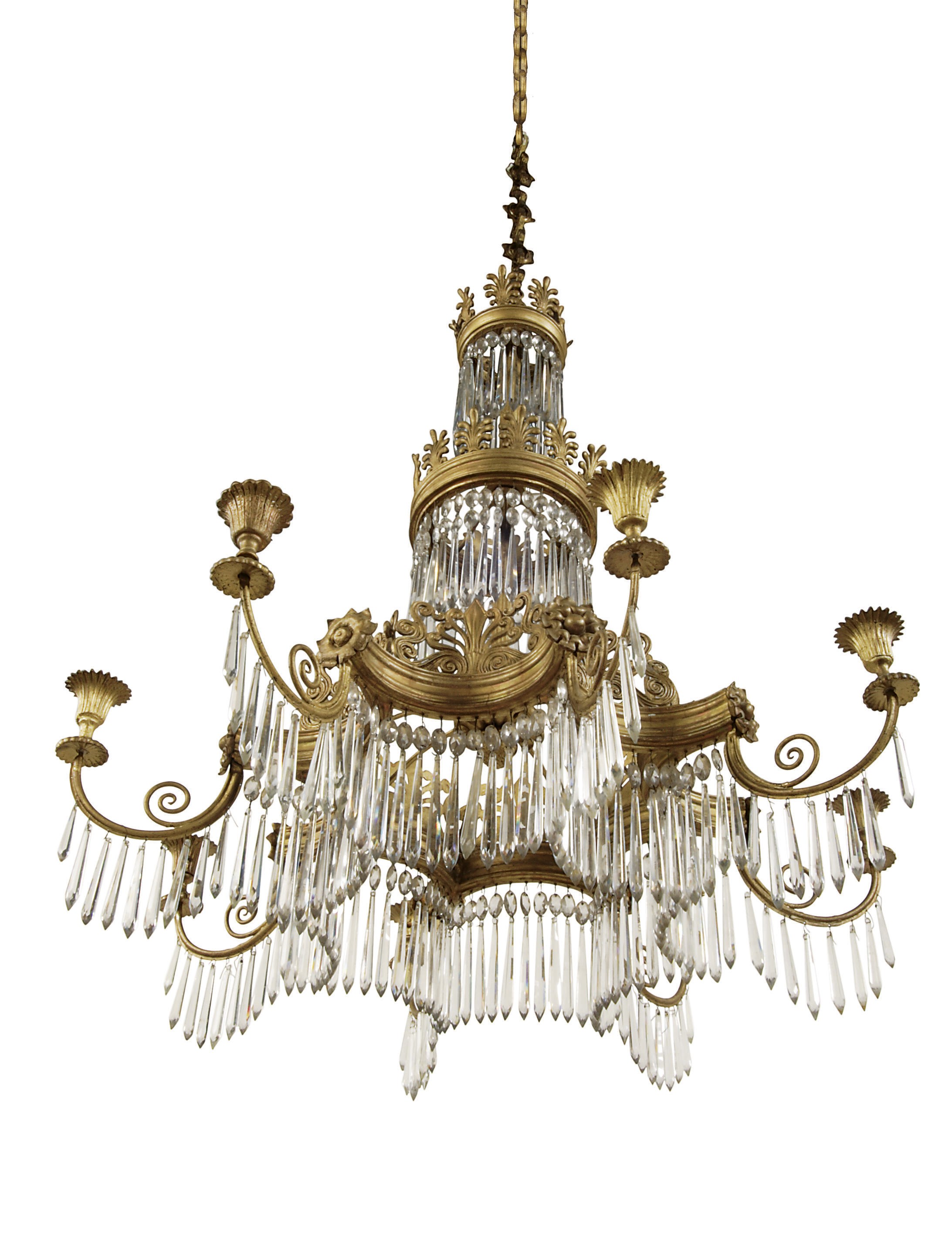 A NORTH GERMAN GILT-METAL, GILT-WOOD, TERRACOTTA AND CUT-GLASS EIGHT-LIGHT CHANDELIER