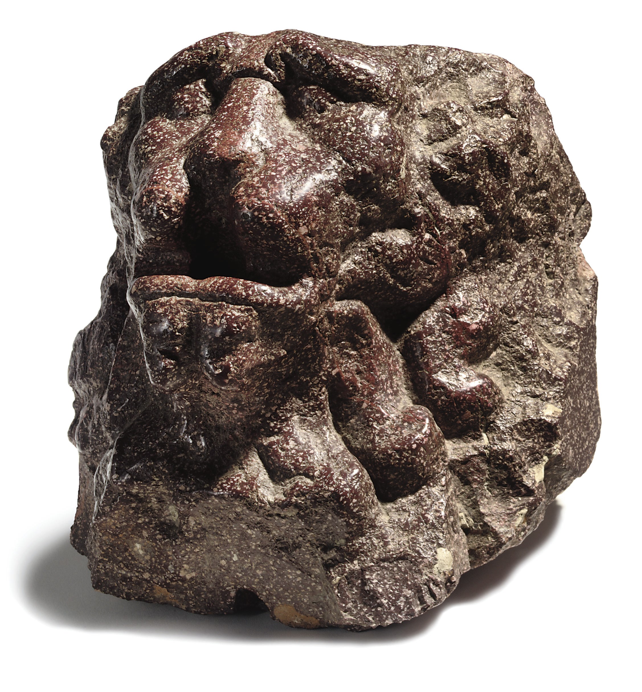 AN ITALIAN PORPHYRY FOUNTAIN HEAD