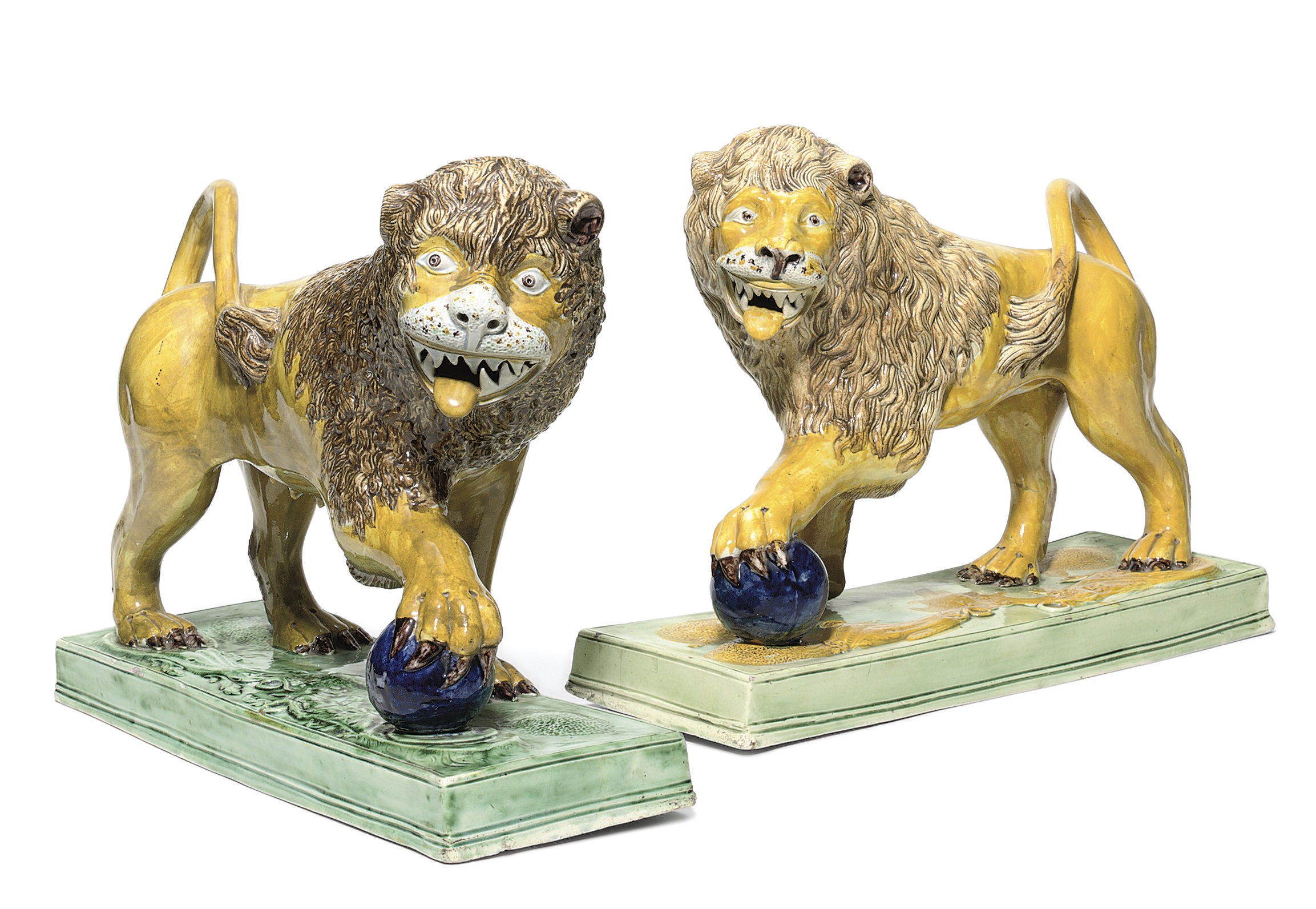 A PAIR OF ENGLISH PEARLWARE MODELS OF A LION AND LIONESS