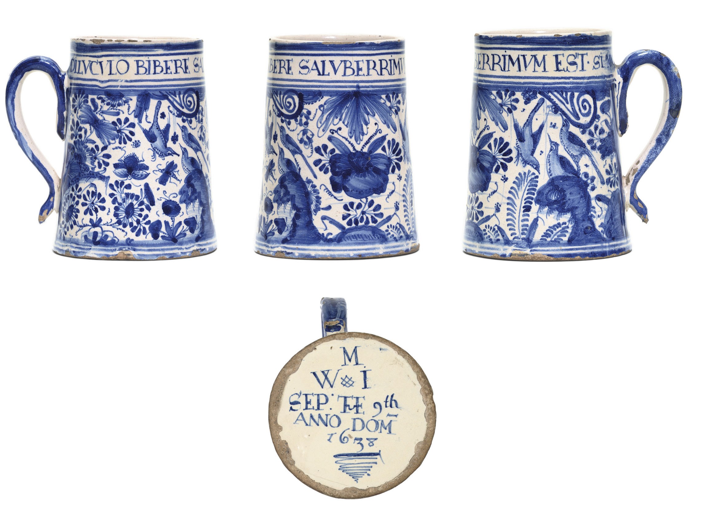 A LONDON DELFT BLUE AND WHITE INSCRIBED AND DATED MUG