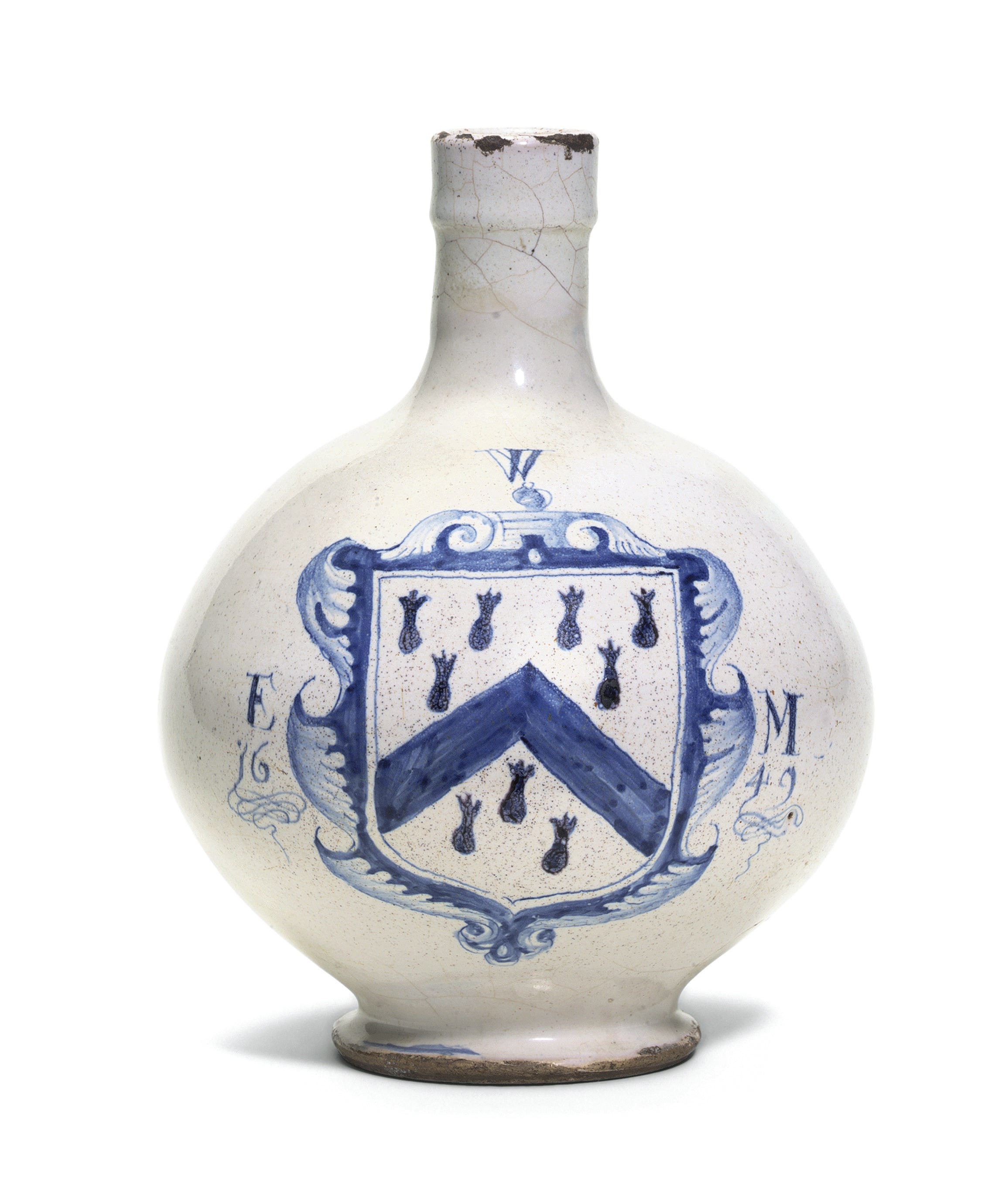 A LONDON DELFT BLUE AND WHITE DATED ARMORIAL WINE-BOTTLE