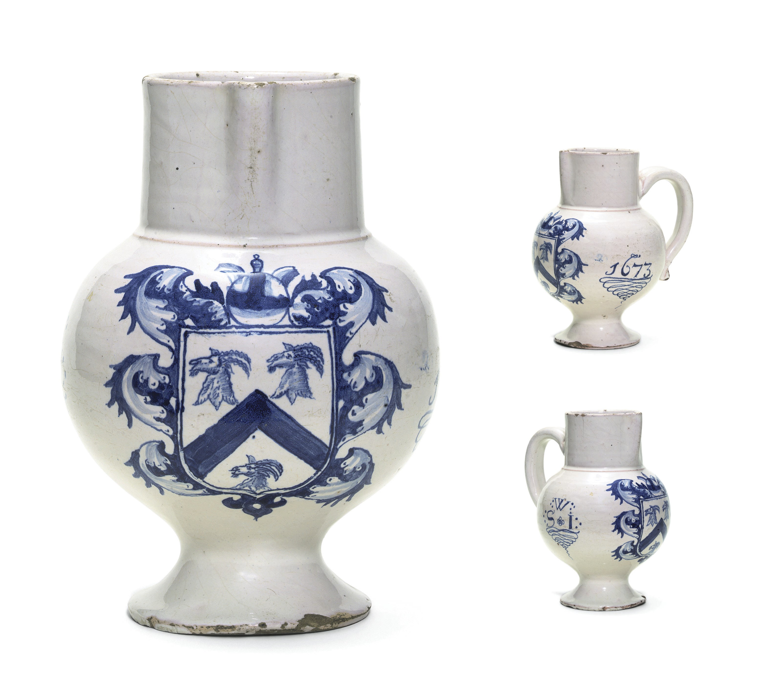 A LONDON DELFT BLUE AND WHITE DATED ARMORIAL JUG