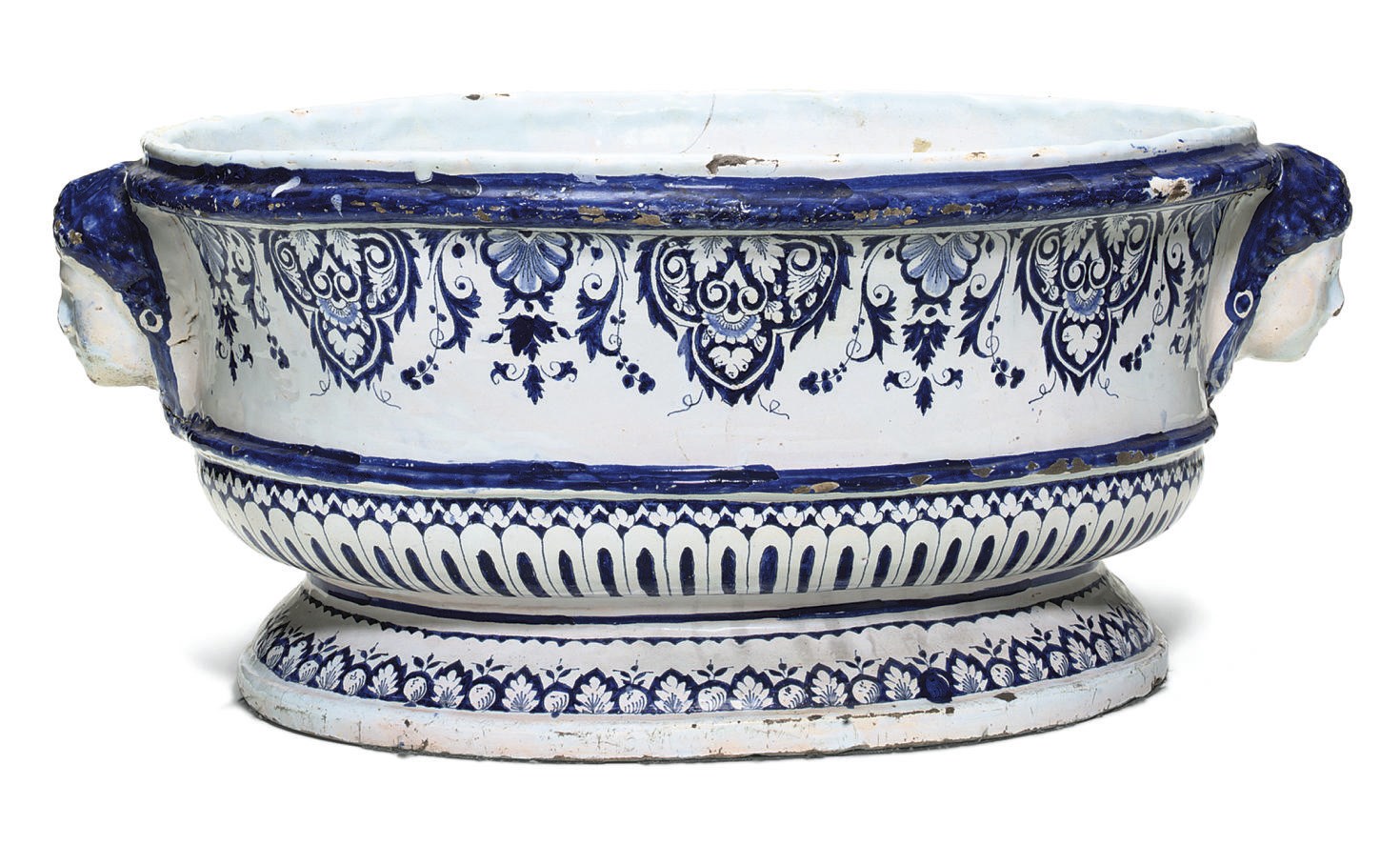 A ROUEN FAIENCE BLUE AND WHITE OVAL CISTERN