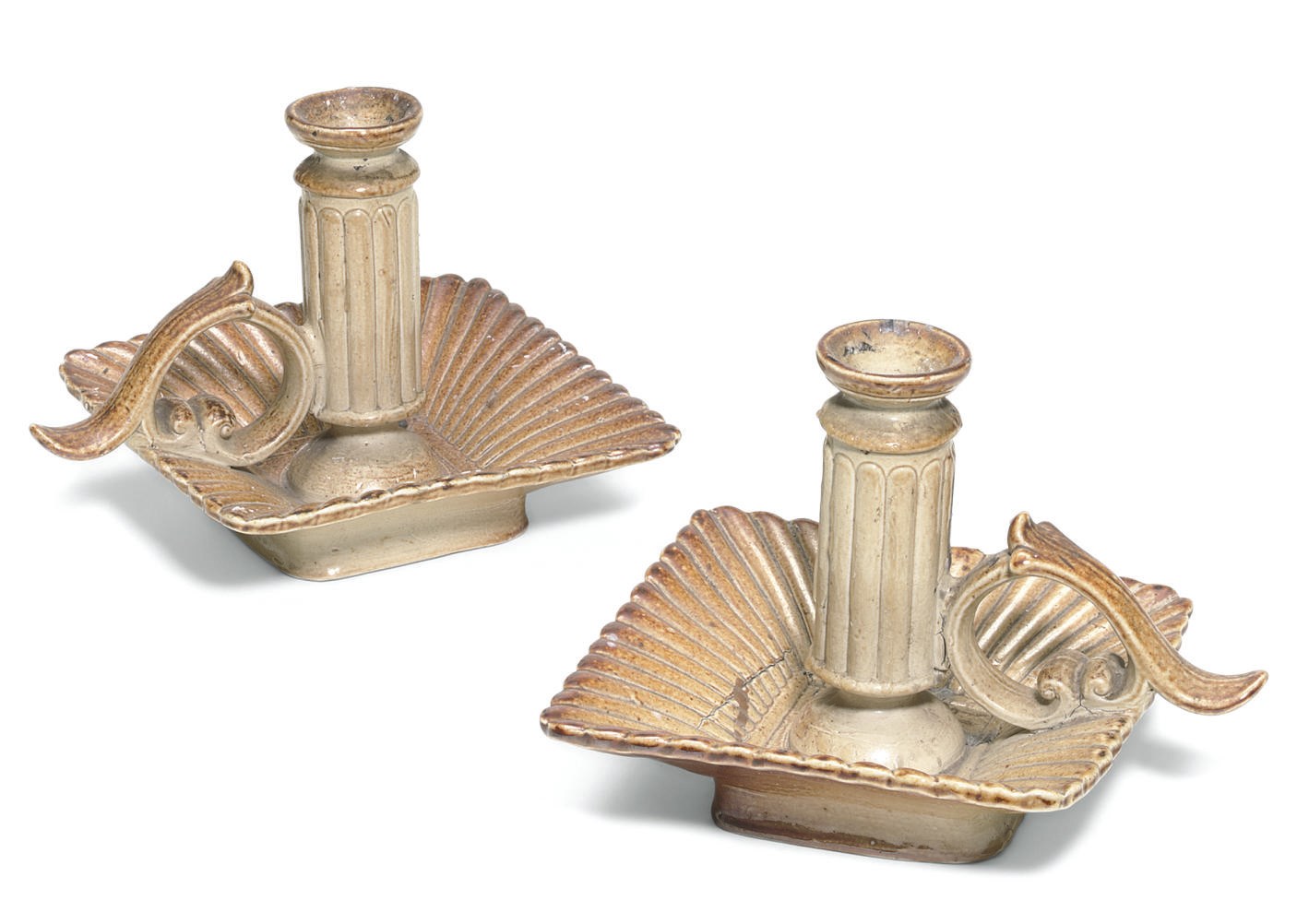 A PAIR OF ENGLISH SALTGLAZED BROWN STONEWARE CHAMBER-CANDLESTICKS