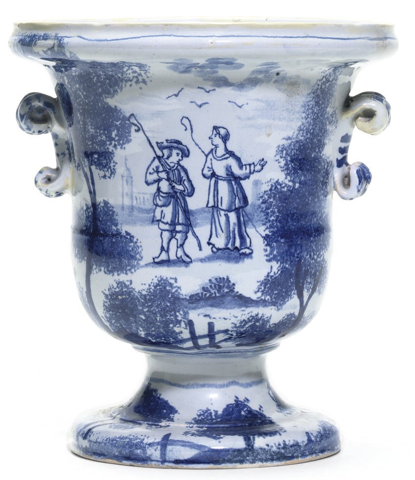 AN ENGLISH DELFT BLUE AND WHITE CAMPANA-SHAPED VASE