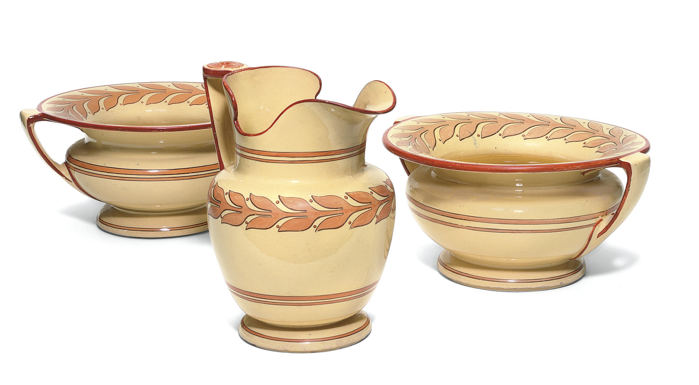 A PAIR OF STAFFORDSHIRE CANE-COLOURED EARTHENWARE TWO-HANDLED BASINS AND AN OVIFORM JUG
