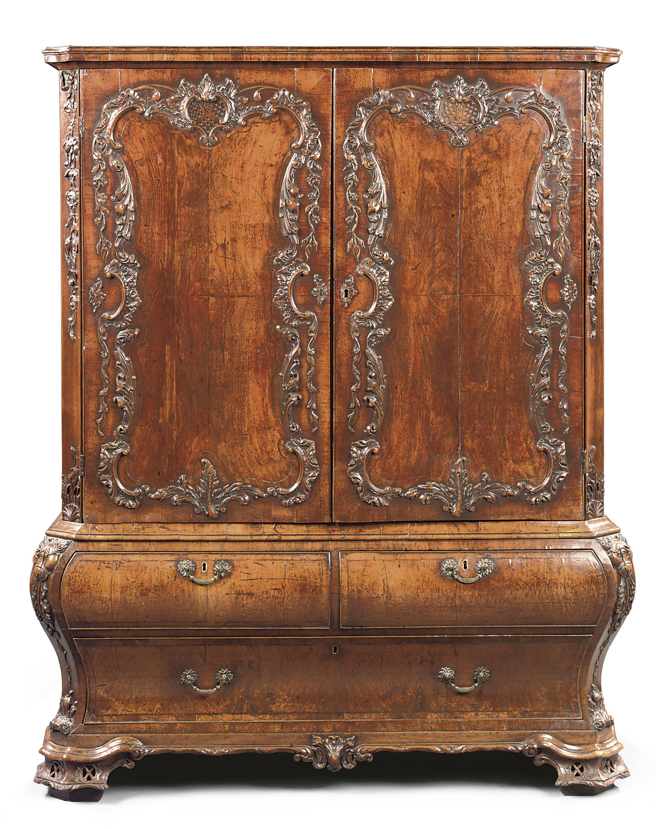 A GEORGE II WALNUT BOMBE CLOTHES PRESS