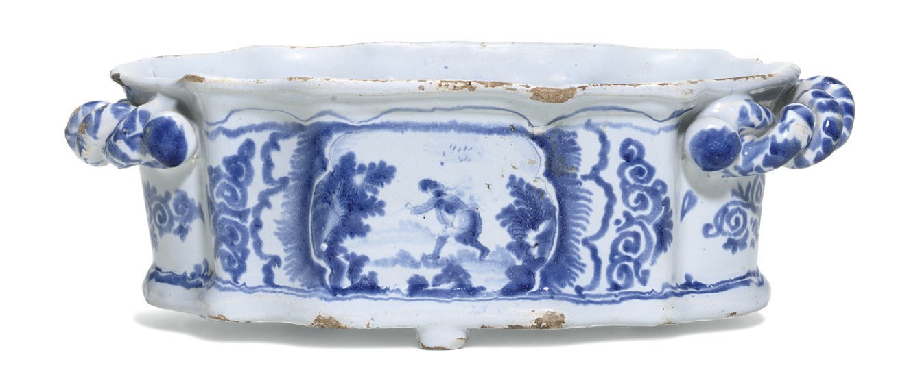A FRENCH FAIENCE BLUE AND WHITE QUATREFOIL TWO-HANDLED JARDINIERE