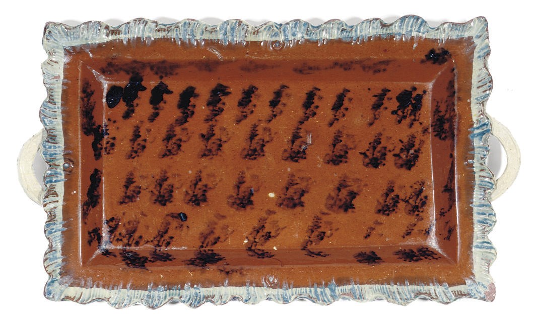 AN ENGLISH RED EARTHENWARE RECTANGULAR TWO-HANDLED TRAY