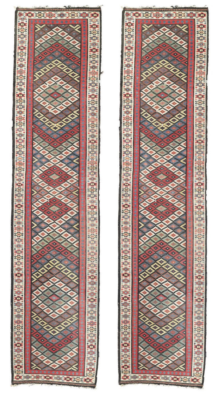 A PAIR OF NORTH WEST PERSIAN KILIM RUNNERS
