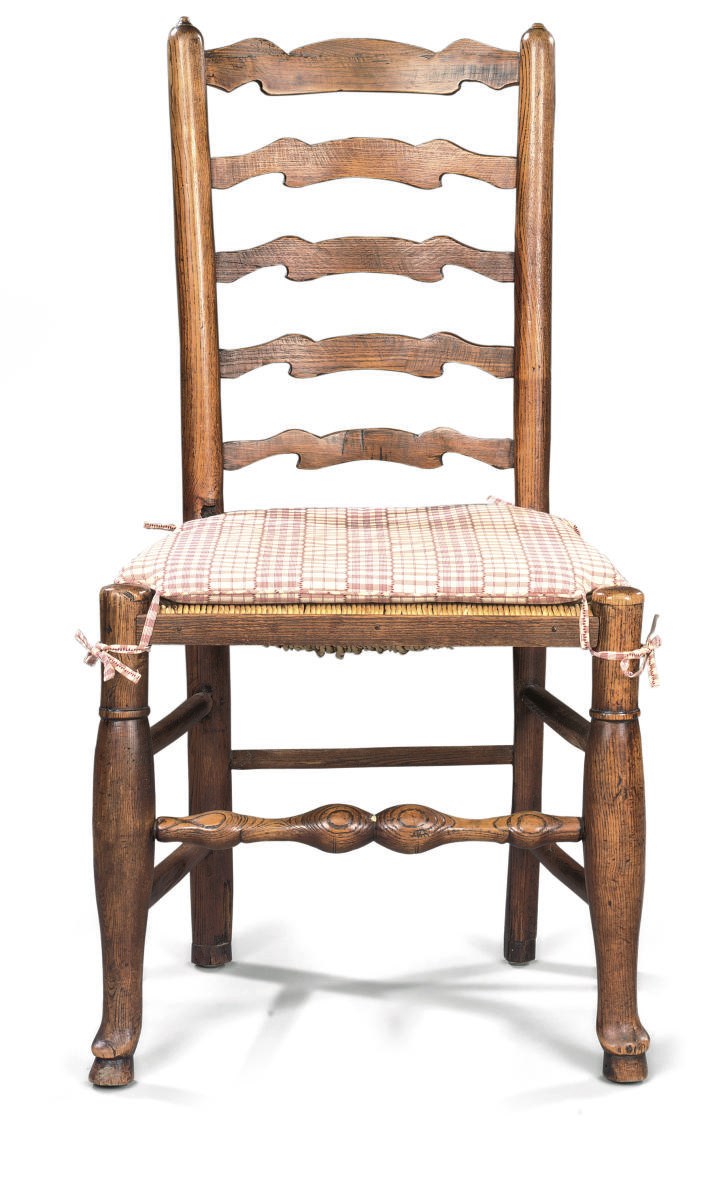 A MATCHED SET OF SIX GEORGE III ASH LANCASHIRE LADDER-BACK CHAIRS