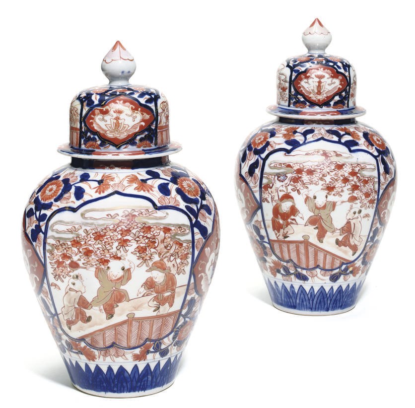 A PAIR OF IMARI OVIFORM JARS AND DOMED COVERS