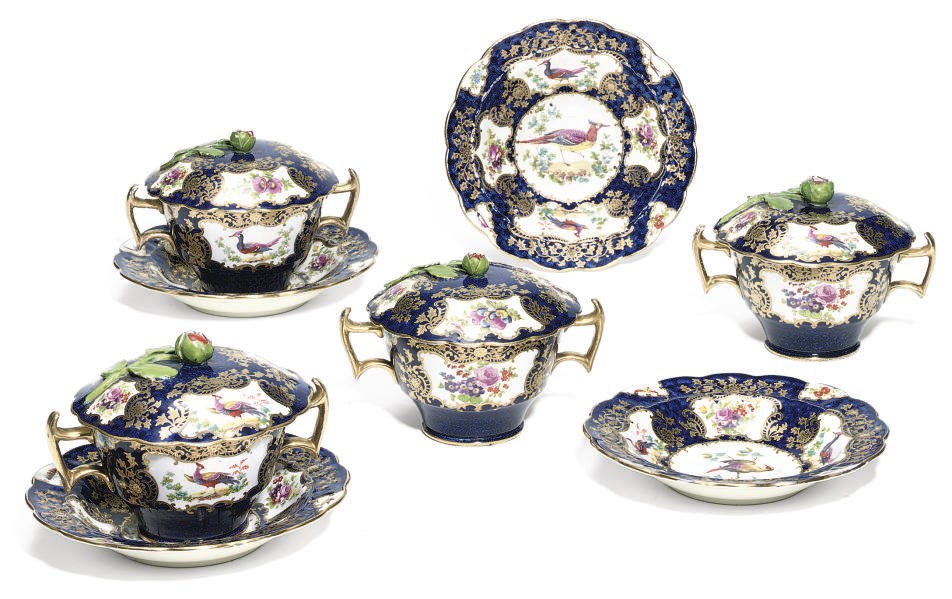 FOUR BOOTHS EARTHENWARE TWO-HANDLED CUPS, COVERS AND STANDS IN THE WORCESTER STYLE AND EIGHT VARIOUS SAUCERS