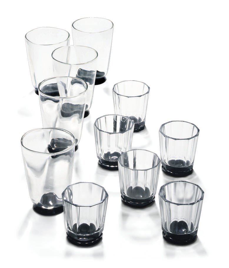 A COMPOSITE ORREFORS GLASS PART TABLE-SERVICE