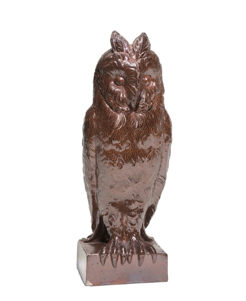 A NOTTINGHAM BROWN SALTGLAZED STONEWARE MODEL OF A LONG-EARED OWL