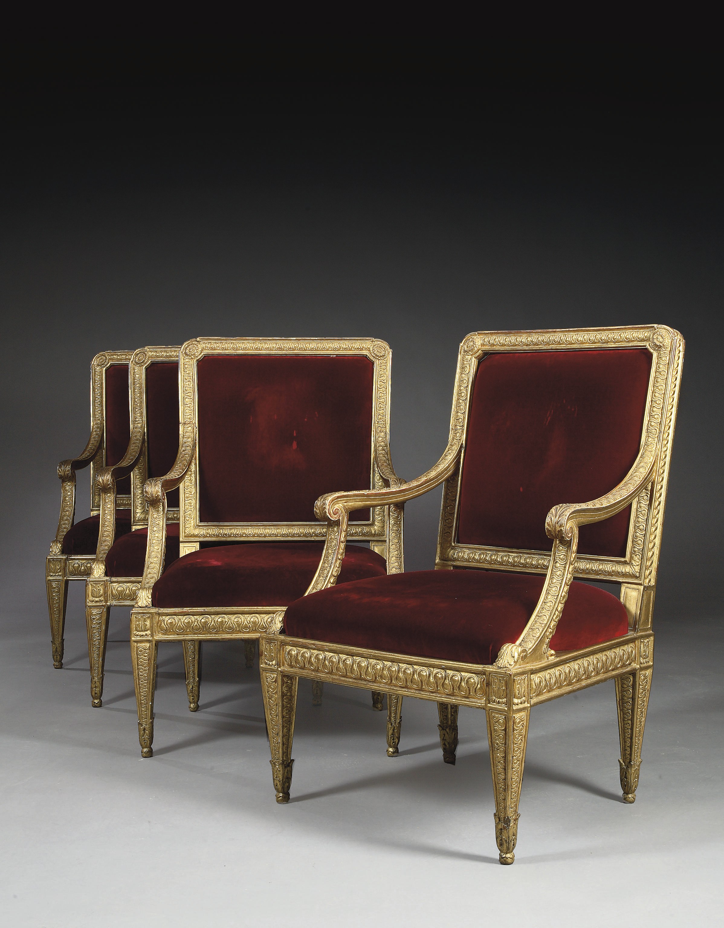 SUITE DE QUATRE FAUTEUILS ITALIENS A CHASSIS