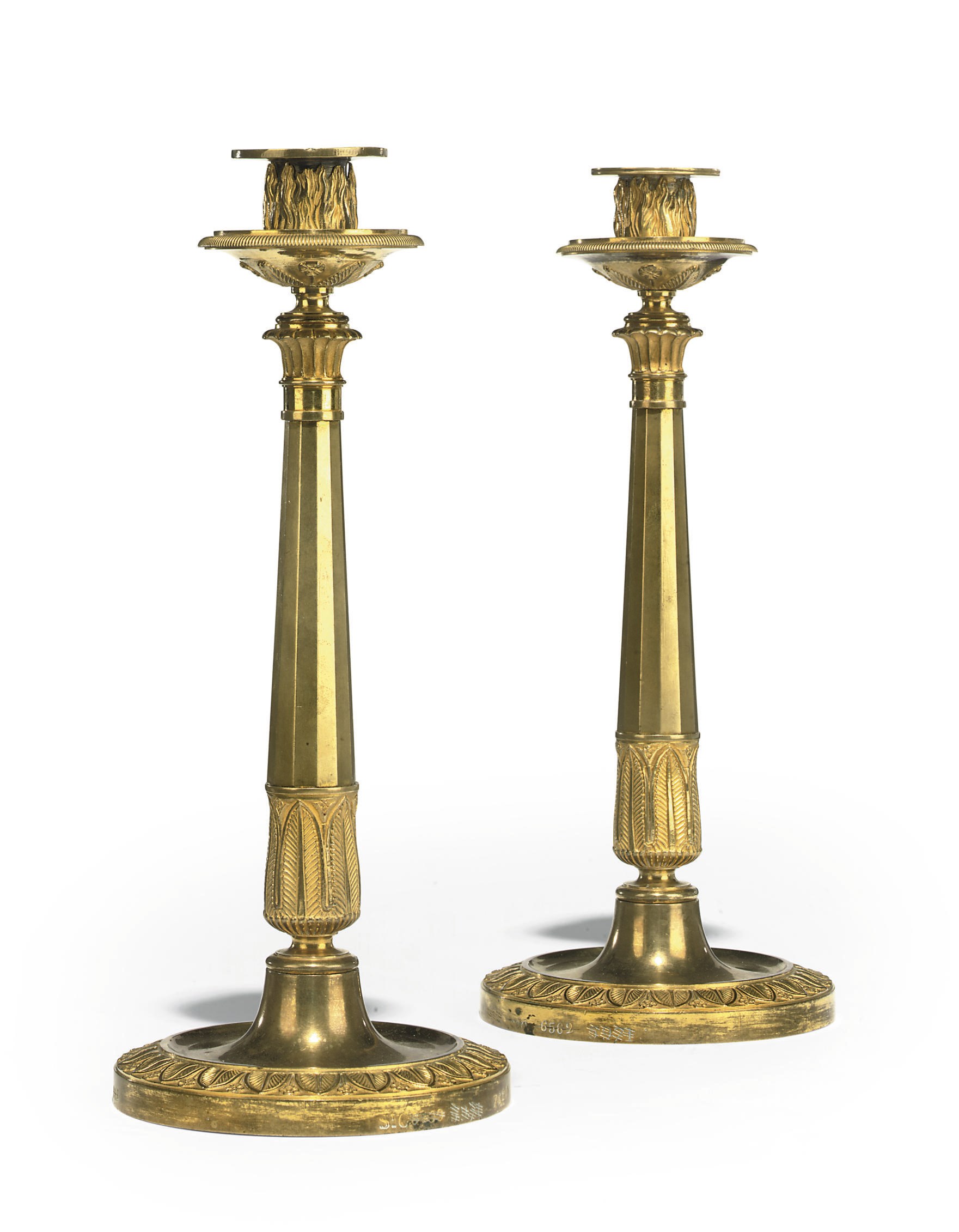 A PAIR OF EMPIRE ORMOLU CANDLESTICKS