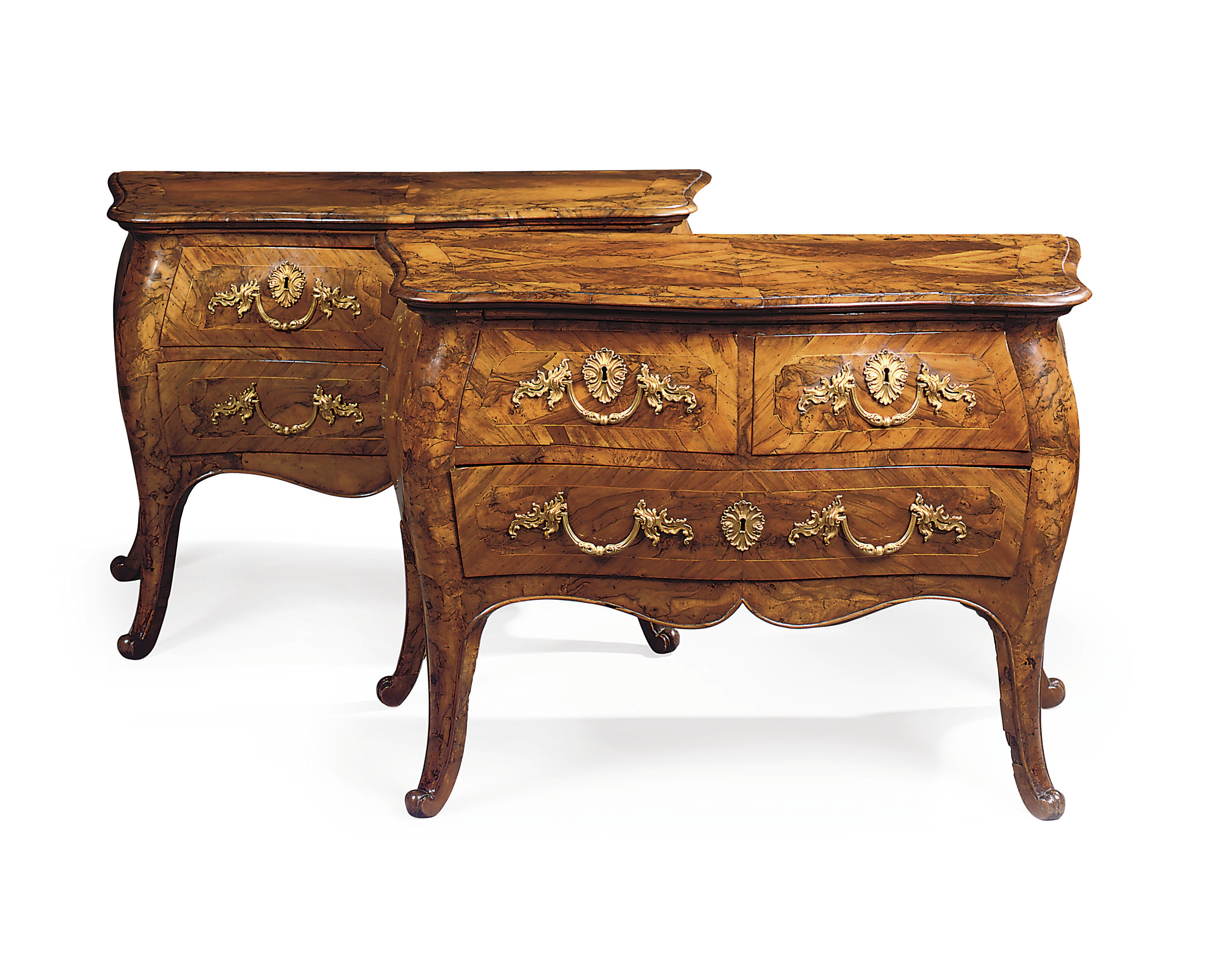 A PAIR OF ITALIAN ORMOLU-MOUNTED WALNUT AND BURR-WALNUT BOMBE COMMODES