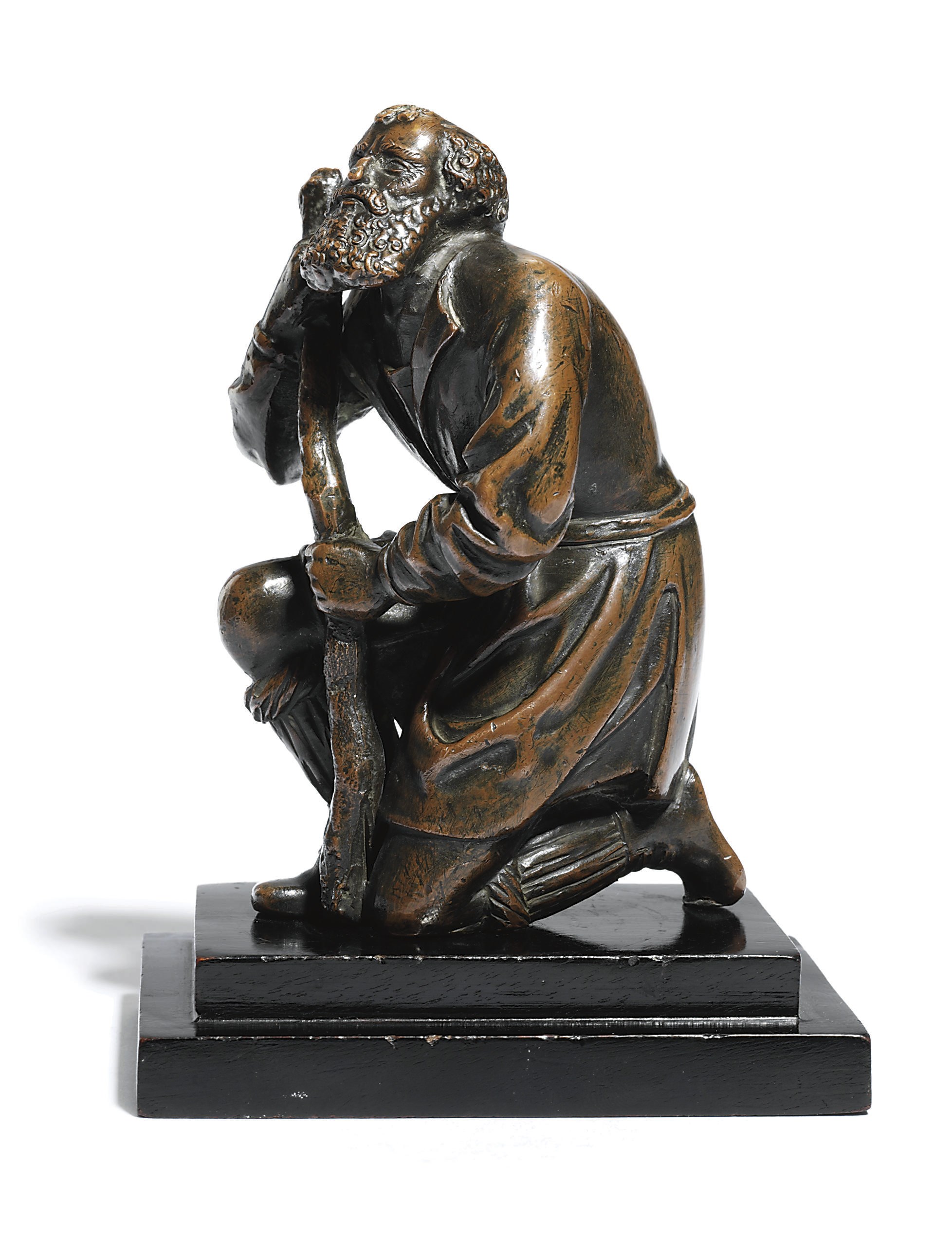 A BRONZE FIGURE OF A KNEELING SHEPHERD