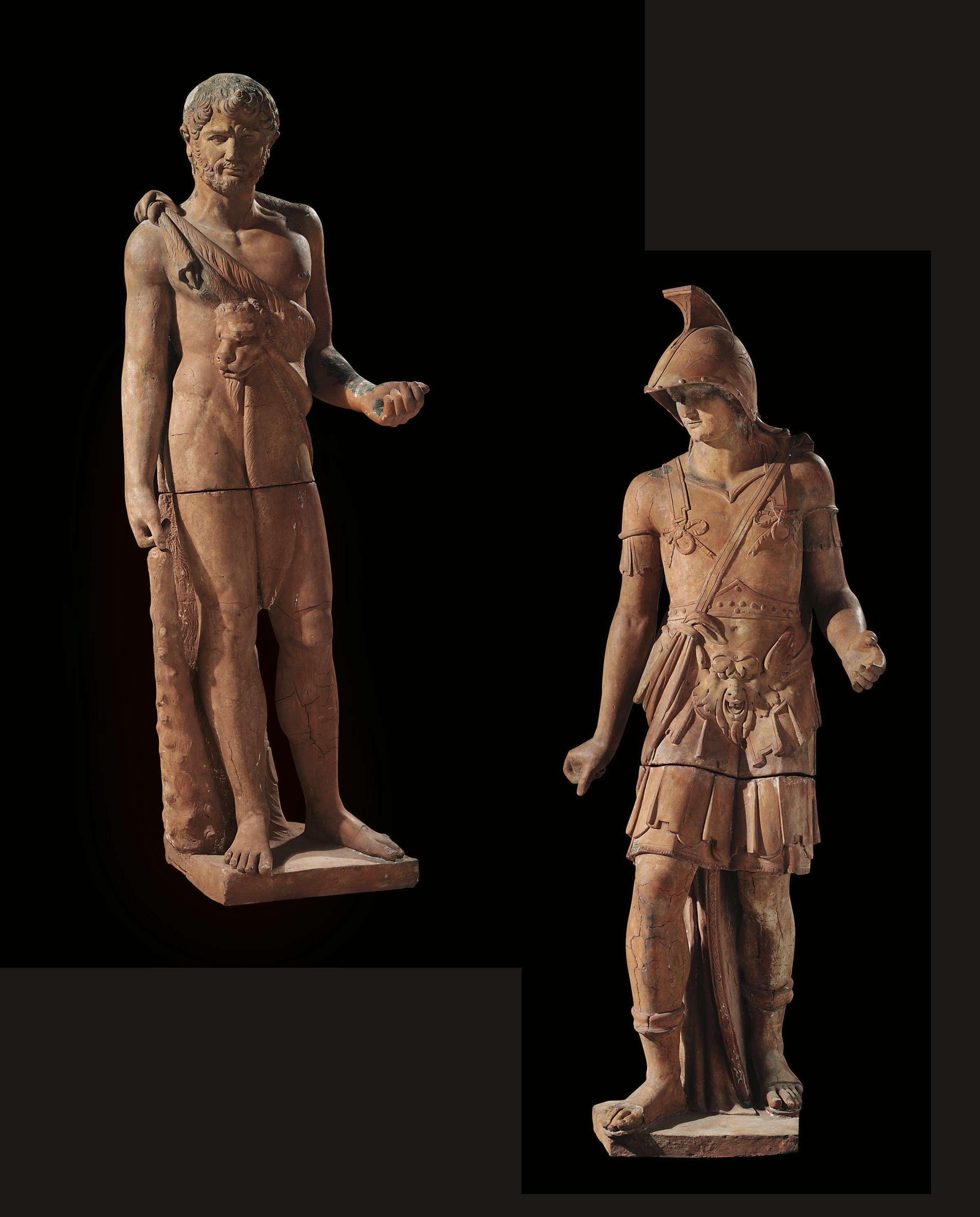 A PAIR OF TERRACOTTA FIGURES OF HERCULES AND APOLLO