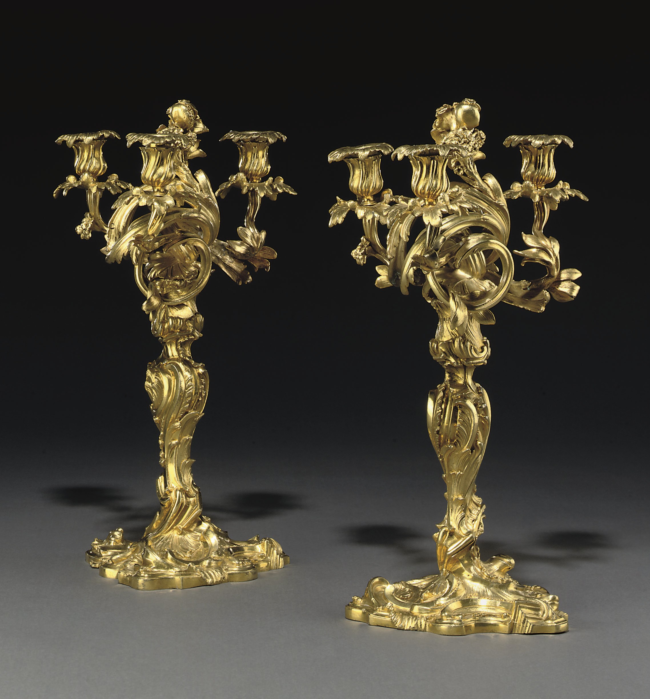 A PAIR OF LOUIS XV ORMOLU THREE-LIGHT CANDELABRA