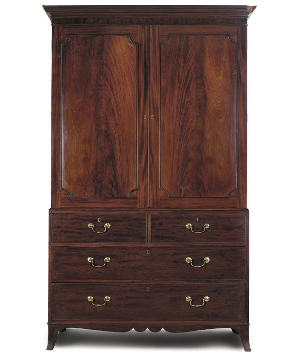 A LATE GEORGE III MAHOGANY LINEN PRESS