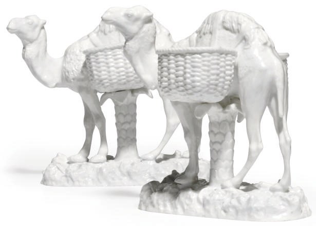 TWO CONTINENTAL WHITE PORCELAIN MODELS OF CAMELS
