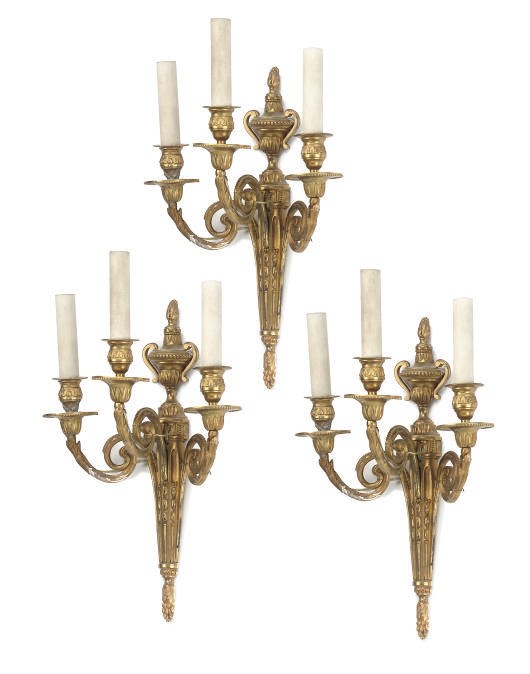 A SET OF THREE GILT-BRONZE THREE-LIGHT WALL APPLIQUES