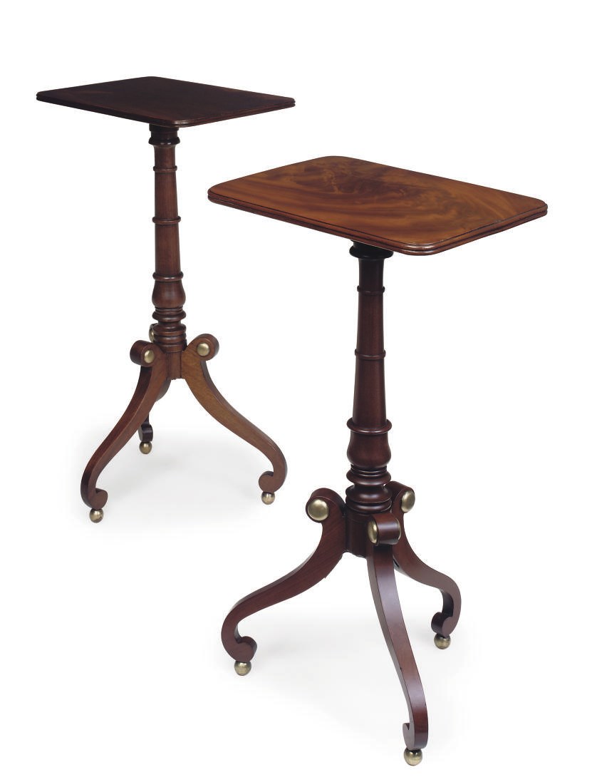 A PAIR OF MAHOGANY AND BRASS MOUNTED TRIPOD TABLES