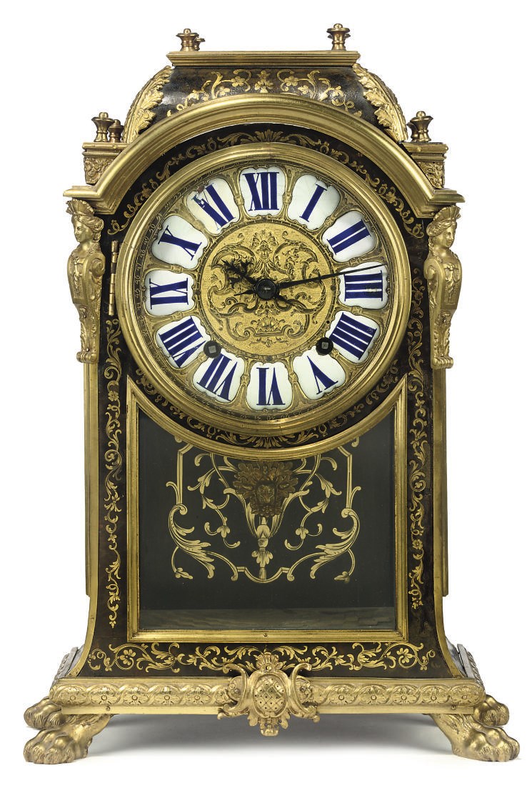 A Louis XIV brass and tortoiseshell inlaid striking mantel clock