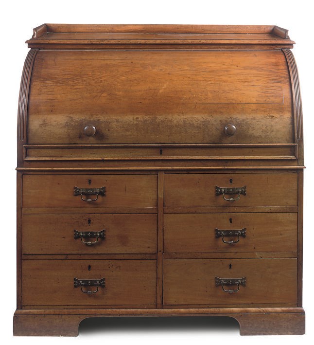 A LATE VICTORIAN MAHOGANY AND OAK ROLL TOP DESK