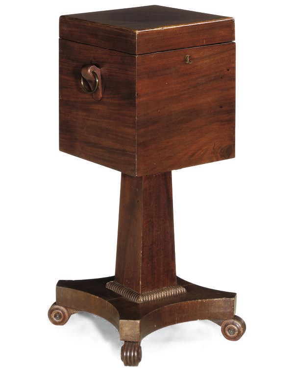 A REGENCY MAHOGANY CELLARETTE ON STAND