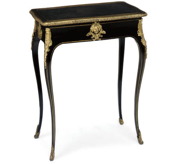 A FRENCH EBONY AND GILT-METAL MOUNTED TABLE EN CABARET