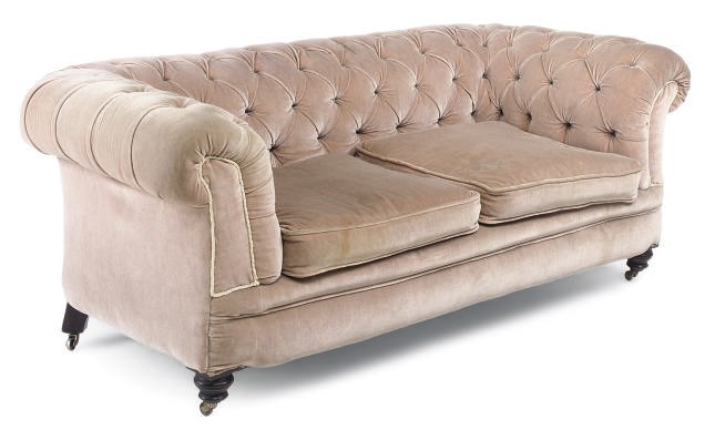 A LATE VICTORIAN EBONISED CHESTERFIELD SOFA