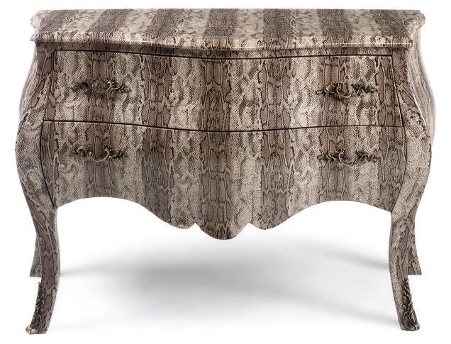 A SIMULATED SNAKE SKIN UPHOLSTERED BOMBE COMMODE