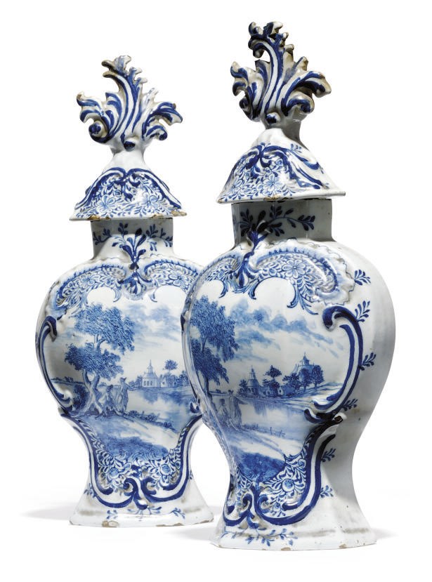 A PAIR OF DUTCH DELFT BLUE AND WHITE BALUSTER VASES AND COVERS