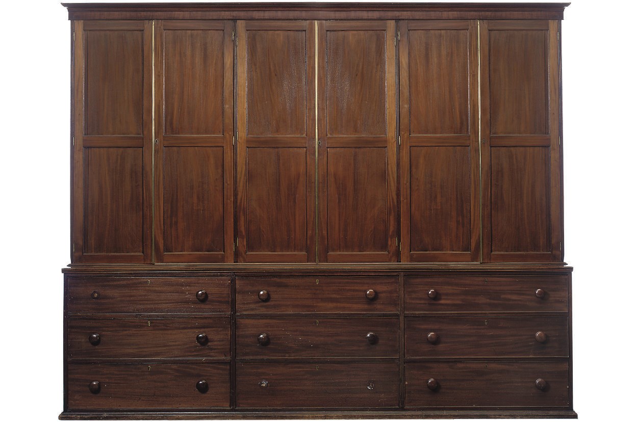 AN EARLY VICTORIAN MAHOGANY HOUSEKEEPER'S CUPBOARD