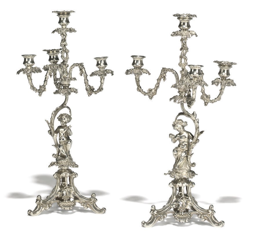 A PAIR OF SILVER-PLATED FOUR-LIGHT CANDELABRA