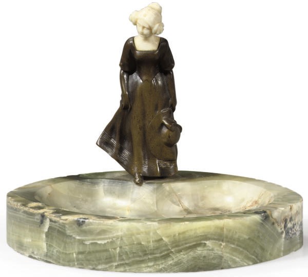 A PATINATED-BRONZE AND IVORY MOUNTED ASHTRAY