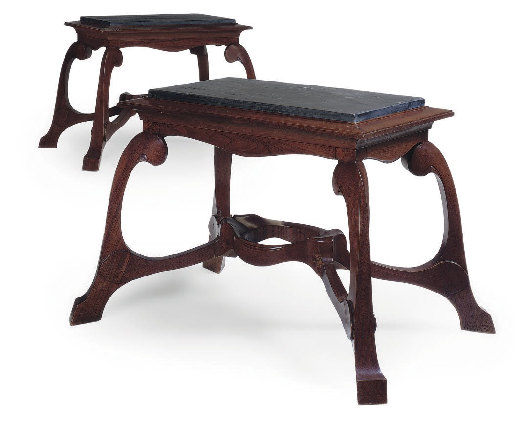 PAUL HANKAR, IN THE STYLE OF, A PAIR OF TEAK AND BLACK SLATE CENTRE TABLES