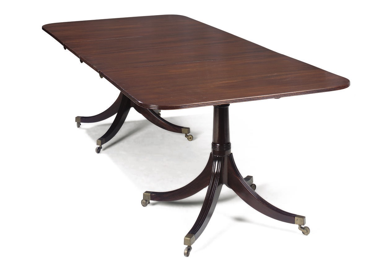 A MAHOGANY TWIN PEDESTAL DINING TABLE