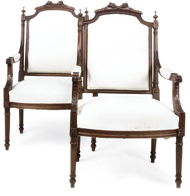 A PAIR OF FRENCH GILT-HEIGHTENED WALNUT FAUTEUILS