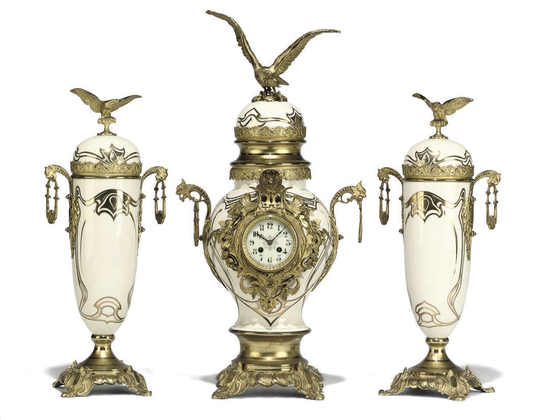 A French large gilt-brass mounted porcelain striking eight day mantel clock and garniture