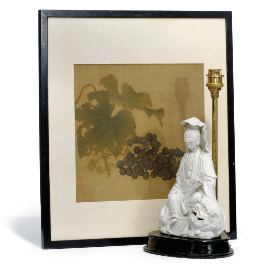 A CHINESE CREAM GLAZED POTTERY MODEL OF GUANYIN