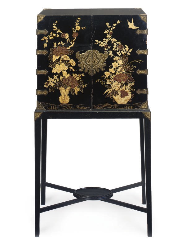 A JAPANESE LACQUERED AND PARCEL GILT CABINET ON STAND